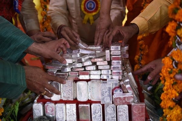 The price of silver hit an eight-year high Monday amid calls on social media to buy the metal.