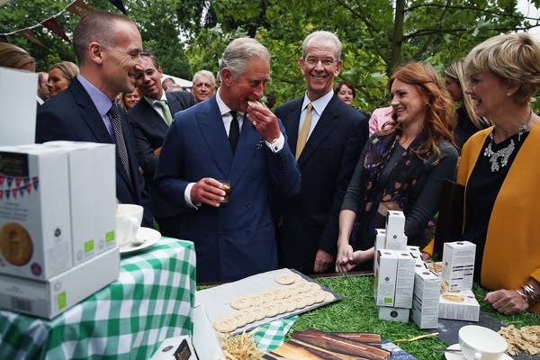 Prince Charles, Prince of Wales tastes a biscuit during a reception to celebrate the 21st anniversary of Duchy originals products at Clarence House on September 11, 2013 in London, England. (Photo by Dan Kitwood - WPA Pool/Getty Images)