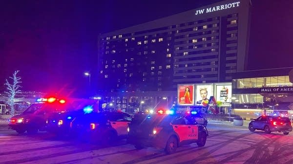 Several squad cars in front of MoA