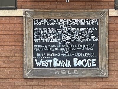 Exterior view of Part Wolf venue on snowy day.