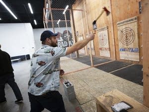 Minneapolis native John Dawson lobs an axe at Bad Axe Throwing.