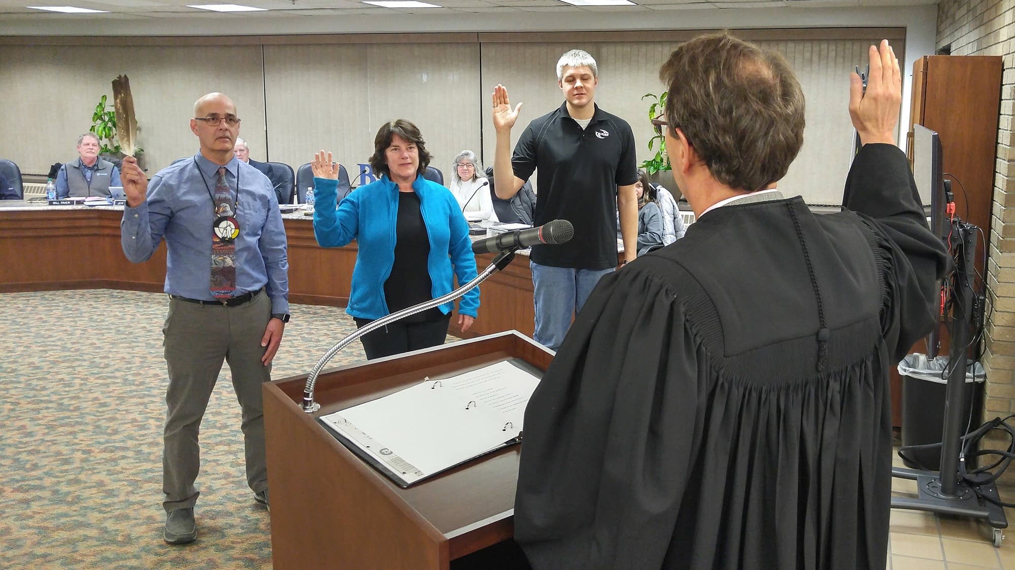 Judge Paul Benshoof swears in Bemidji Area Schools board members in Jan.