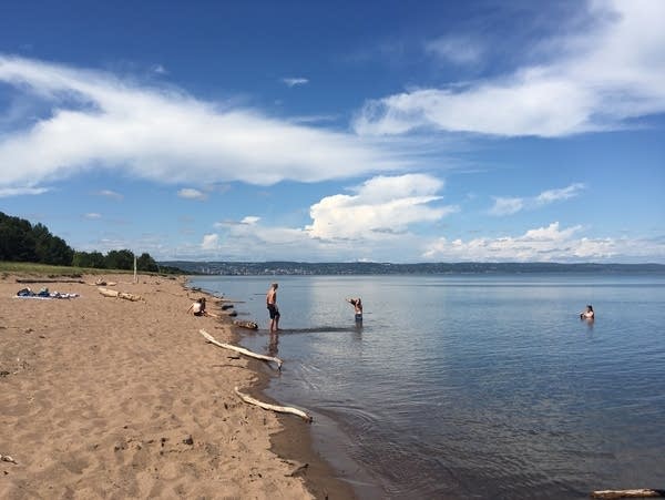 Kids splash in Lake Superior along Park Point.