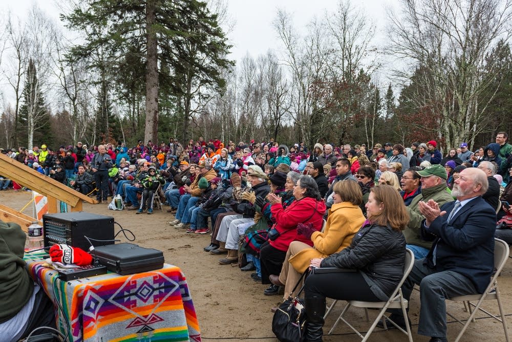 People were bussed to the site for the ceremony