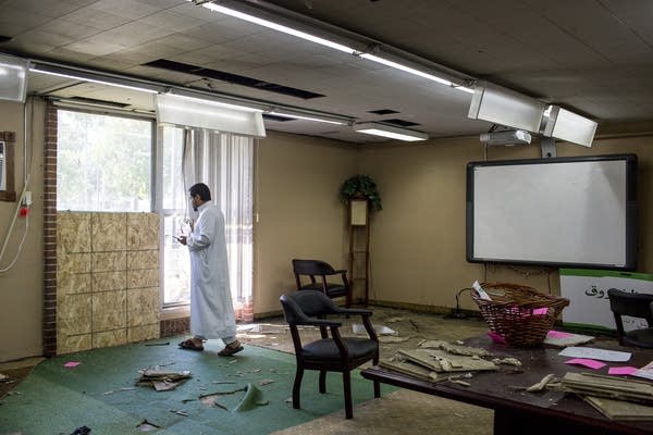 Asad Zaman stands at the site of the bombing.