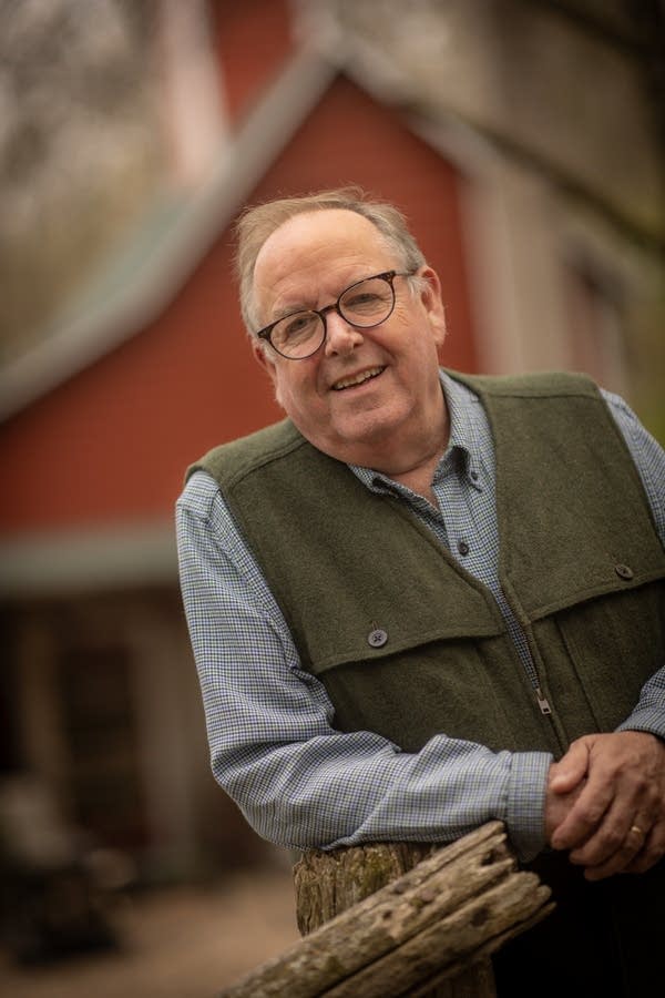 An author poses for a photo portrait.