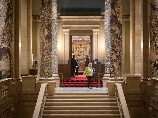A woman leaves the house chamber 