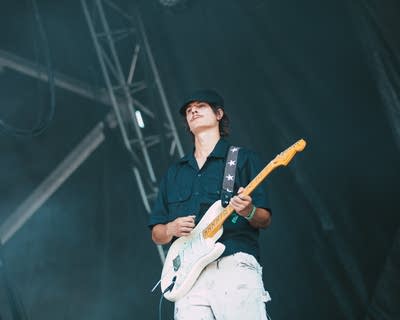 guitarist of porch light performing on stage