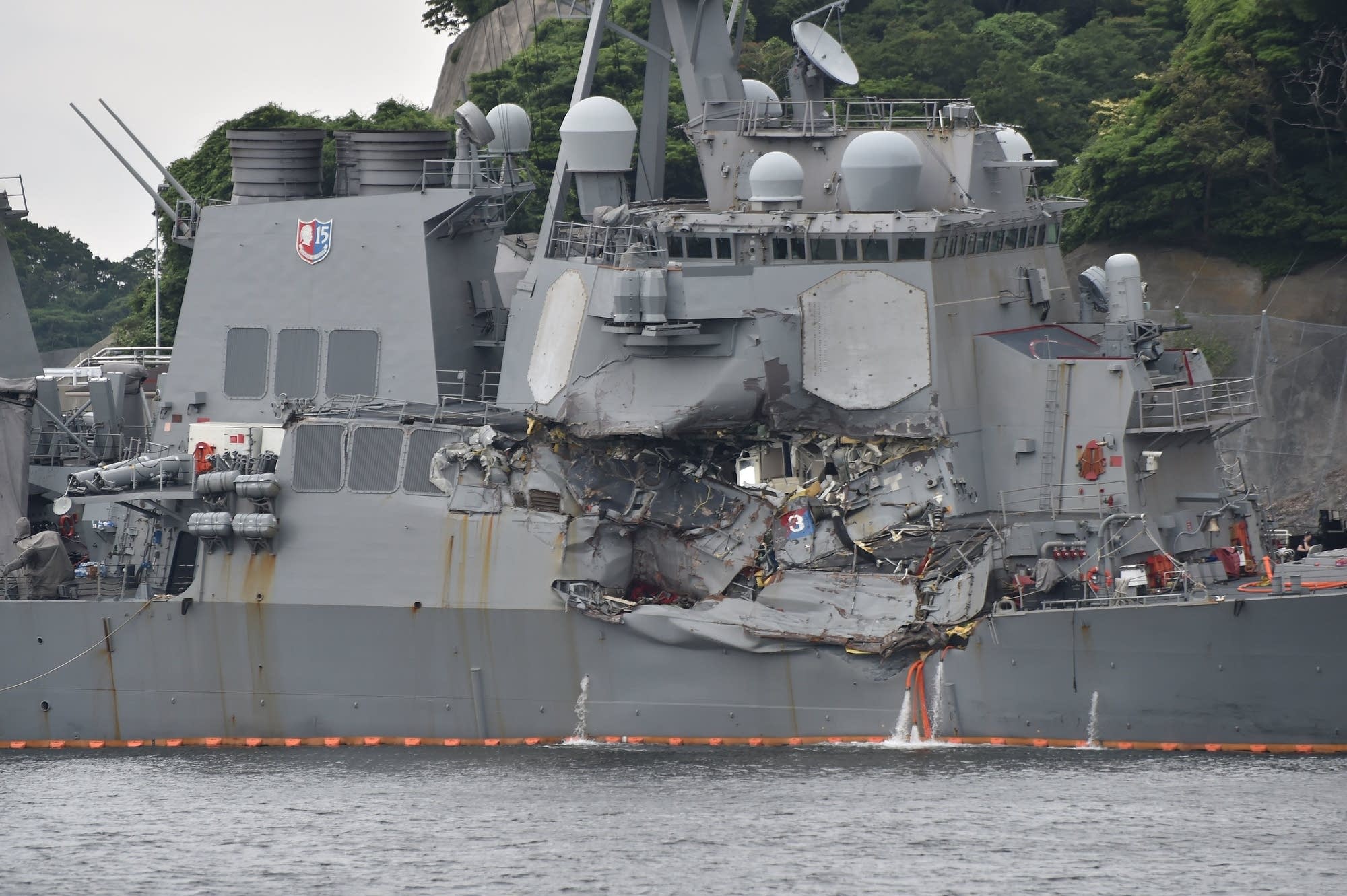 A number of missing American sailors have been found dead in flooded areas.