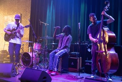 evan slack papa mbye and cole davis performing on stage