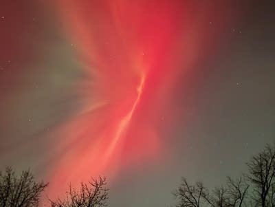 Red and green lights cover the night sky.