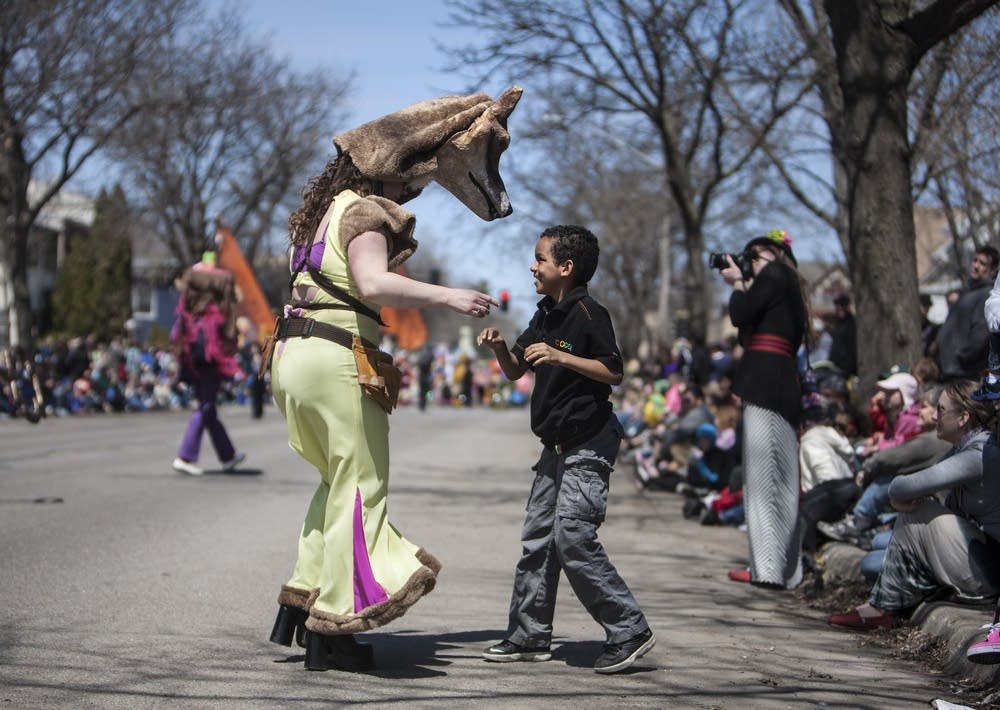 Isiah Ayala, 8, dances with a fox.