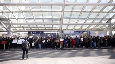 Immigration policy protesters at a rally against Trump's executive order.