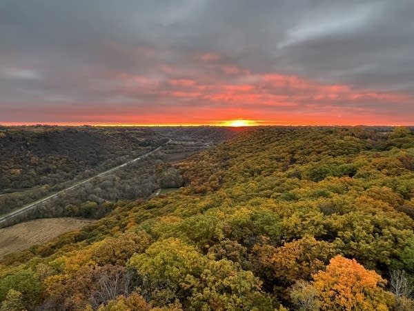 Color starts to spread across the sky at sunrise