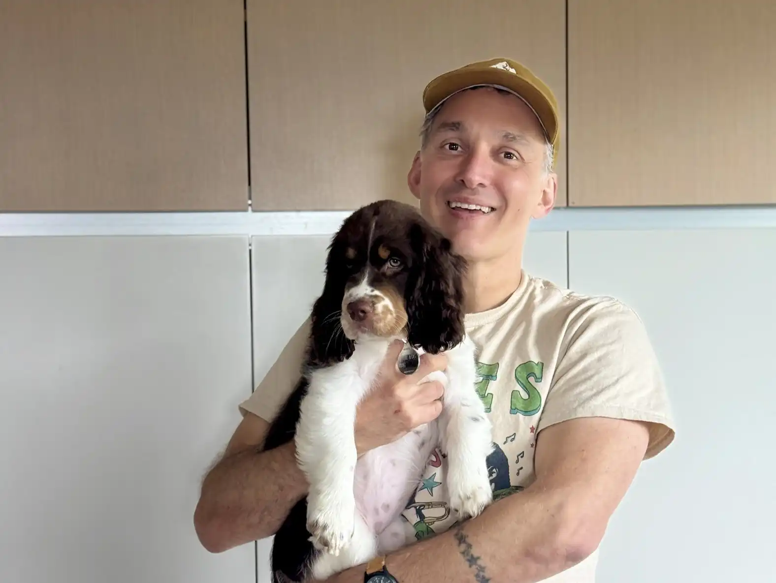Man holding puppy