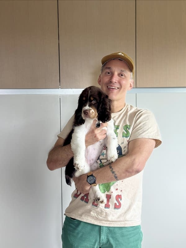 Man holding puppy