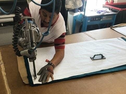 Above, a worker at Lefty Production in Los Angeles. CEO Marta Miller thinks brands ordering less inventory in the wake of the pandemic could help drive American manufacturing. 