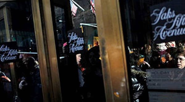 Shoppers flow in and out of Saks Fifth Avenue department store December 27, 2009, in New York City.