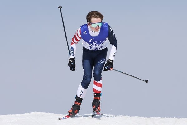 a man is seen cross-country skiing