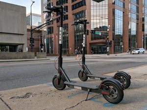 Bird scooters parked along Seventh Street in St. Paul.