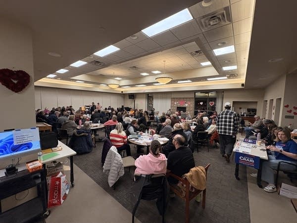 People meet for a political caucus