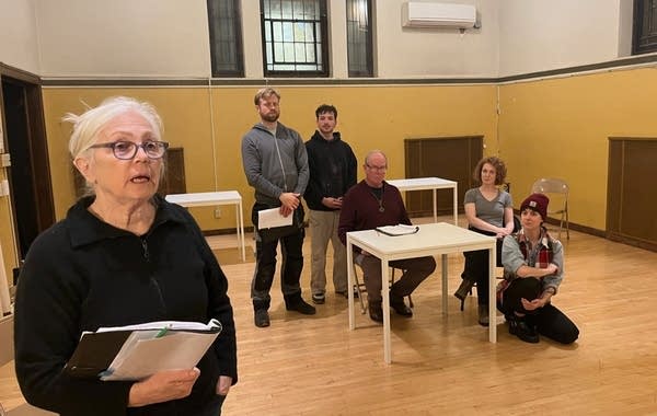 six people doing play rehearsal