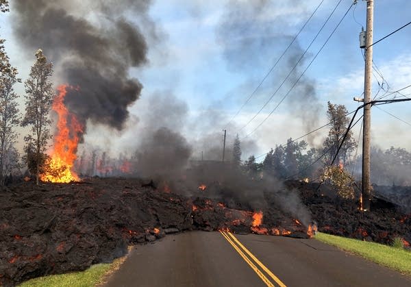 Lava spewing from Hawaii volcano destroys dozens of homes