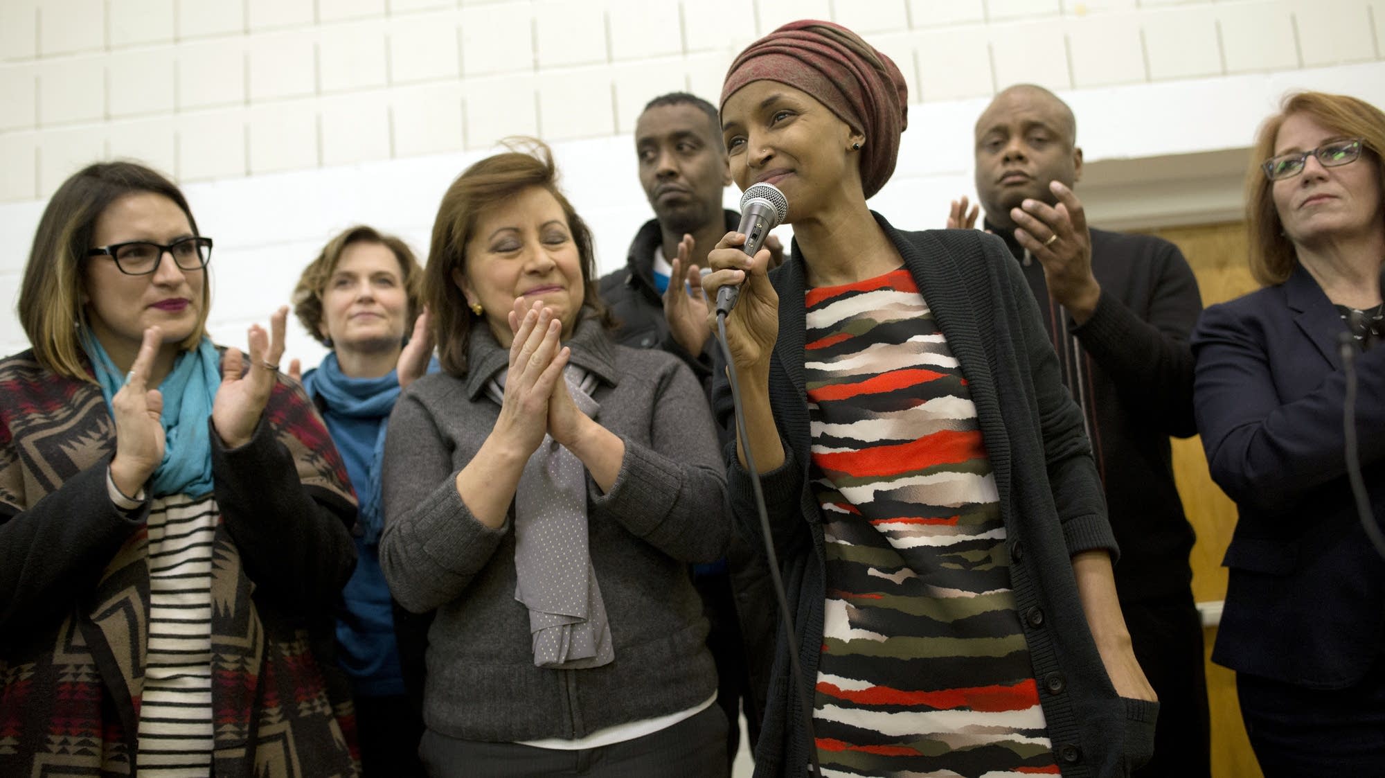 State Rep. Ilhan Omar and other state and city officials speak at a rally.