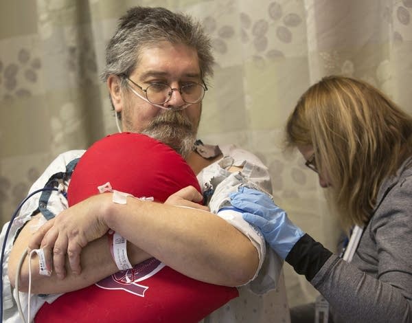 ICU patient Daniel Hage gets a skin check.