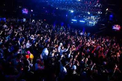 crowd watching anderson .paak perform a dj set on stage