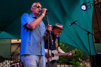 Two men performing on stage