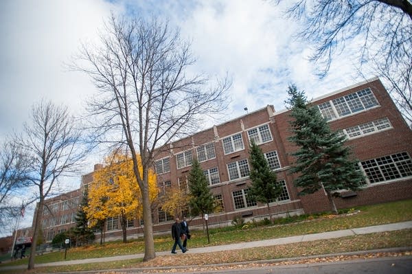 Volunteers leave Patrick Henry High School.