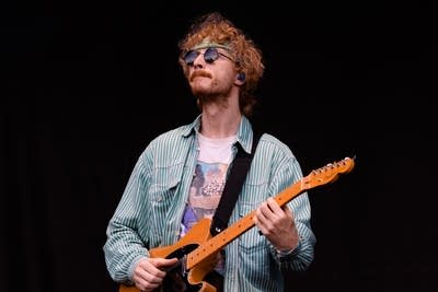 remi wolf and her band performing on stage