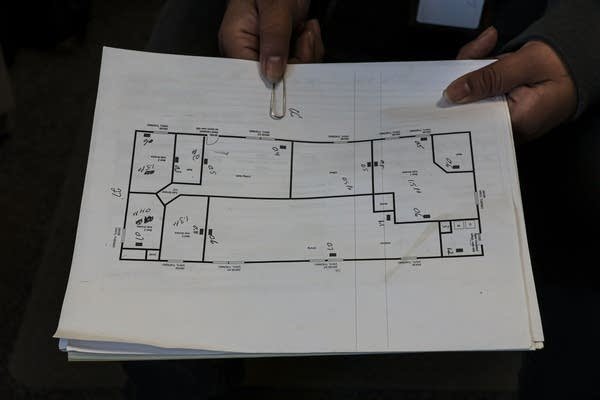 Person holds blueprint