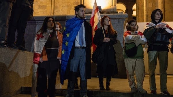 People participate in a protest outside the Georgian Parliament Tbilisi on Monday.