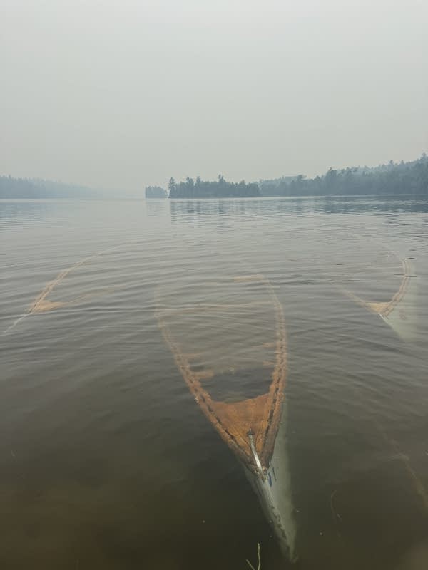 Canoes under water