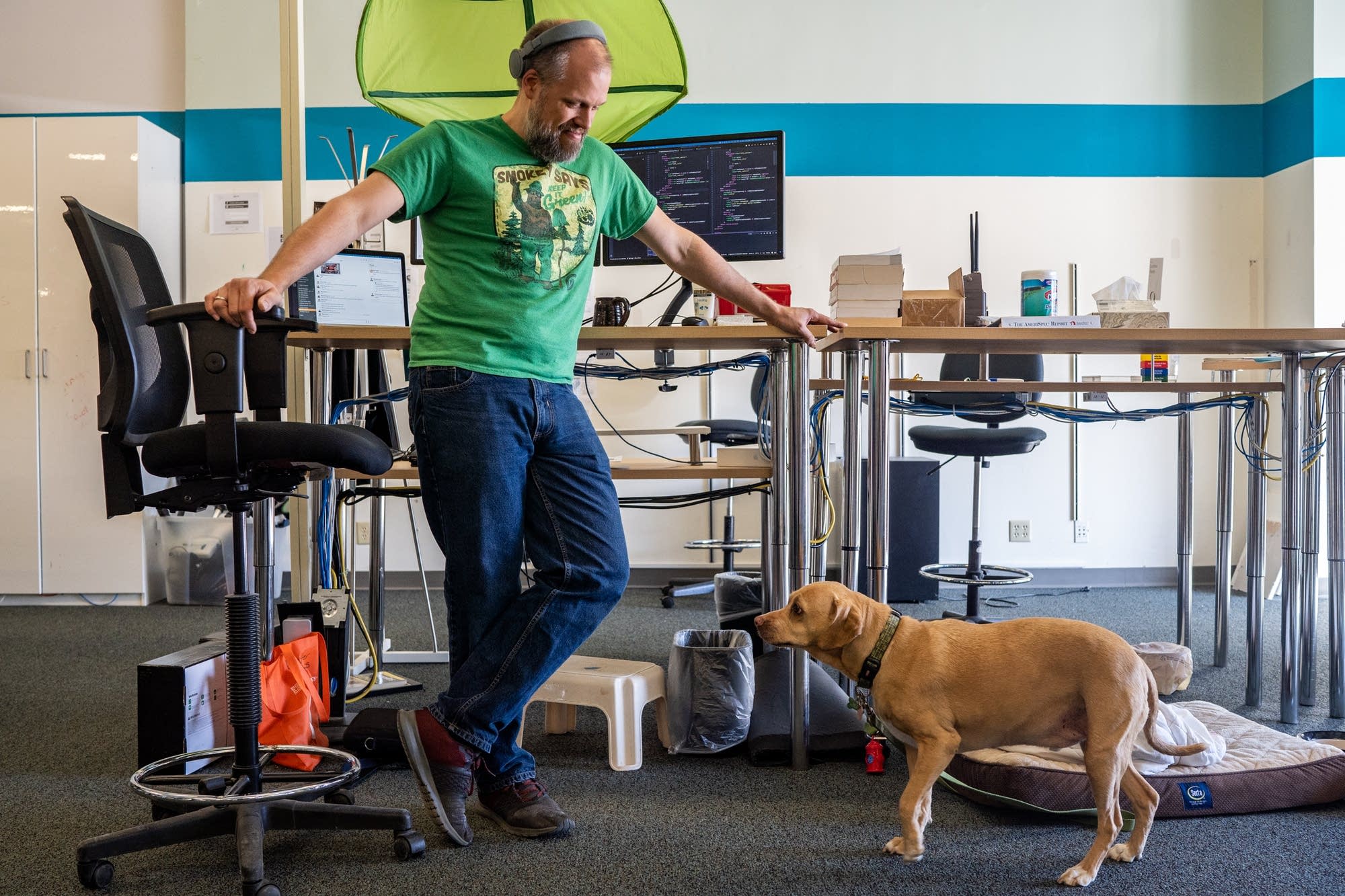 Mark Thomes stands at his desk inside Nerdery.