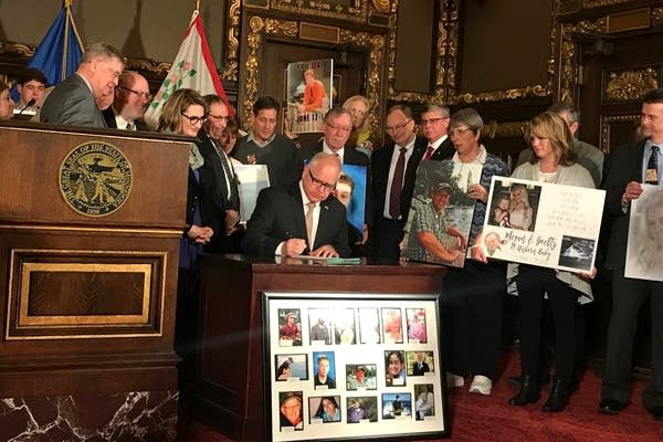 Gov. Tim Walz signs the hands-free while driving law