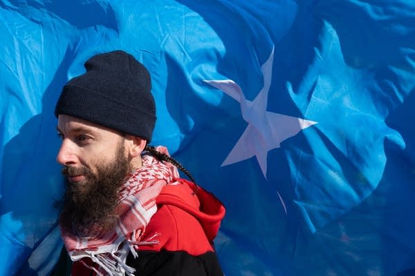 man carrying flag
