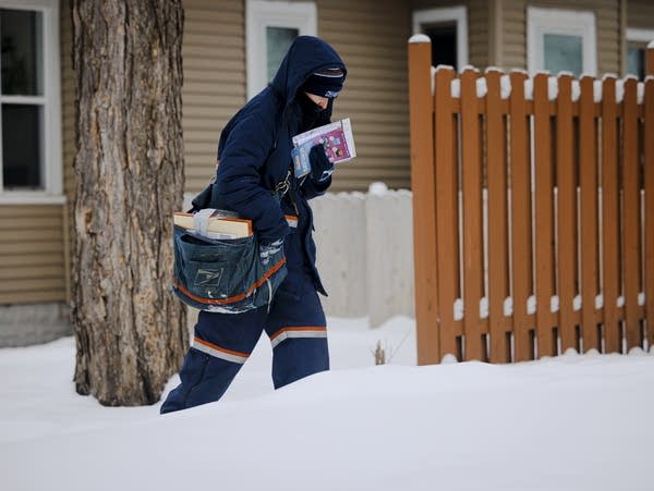 A person carries mail