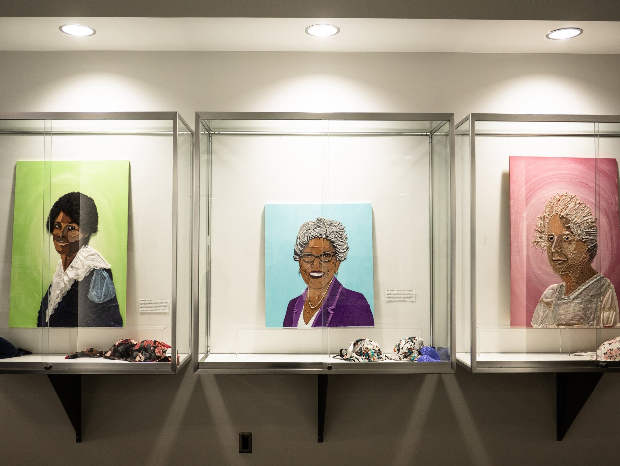 Three portraits of prominent women in history made out of bras