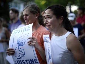 Betsy Custis, right, and others attend a march in honor of Justine Damond.