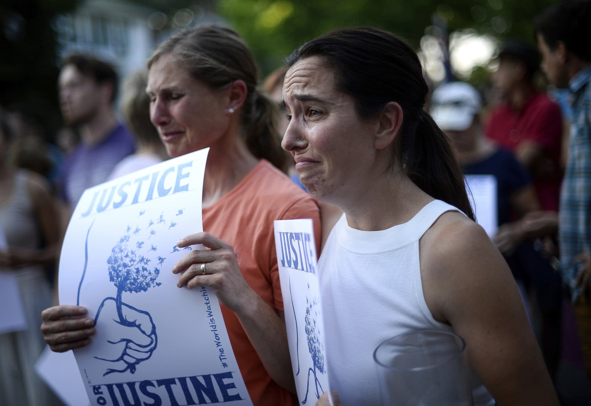 Betsy Custis, right, and others attend a march in honor of Justine Damond.