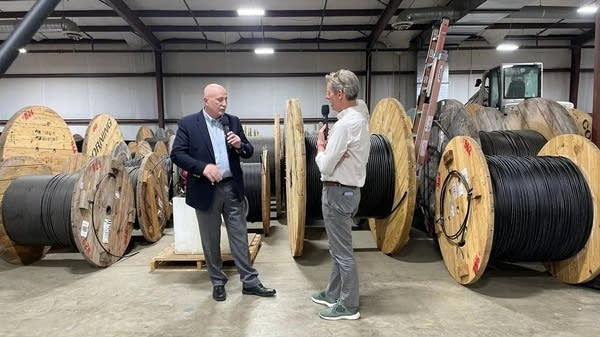 Kai Ryssdal, right, interviews Keith Gabbard, CEO of Peoples Rural Telephone Cooperative, in McKee, Kentucky.