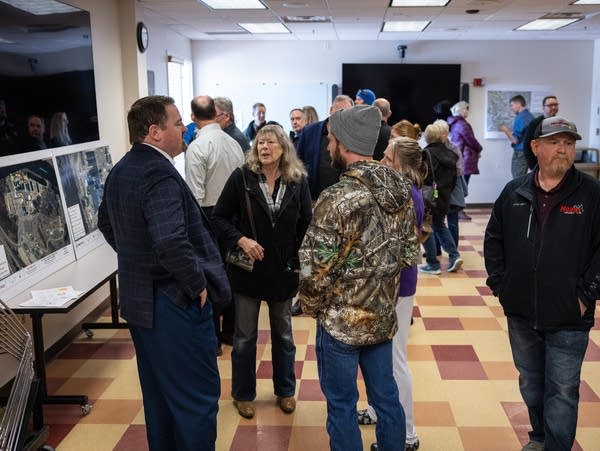 People fill a community center room