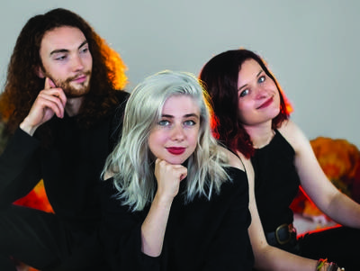 Three people sitting together for a portrait