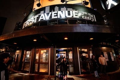 Music fans open the doors of a music venue