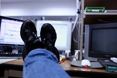 Feet on desk at work