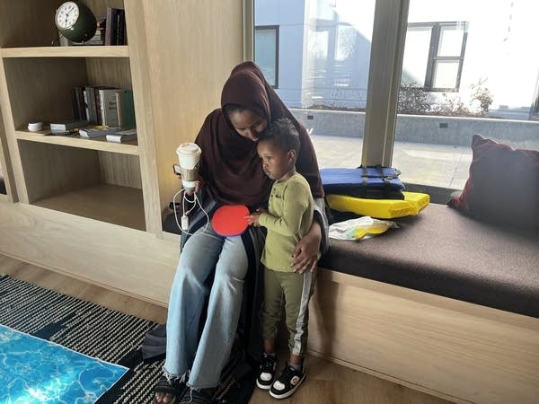 A woman talks with her son