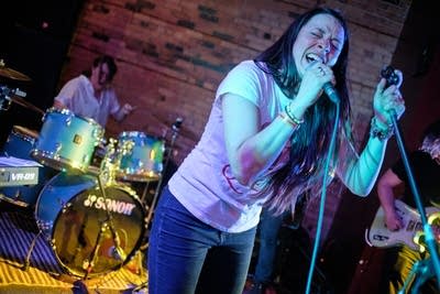 Two musicians performing onstage